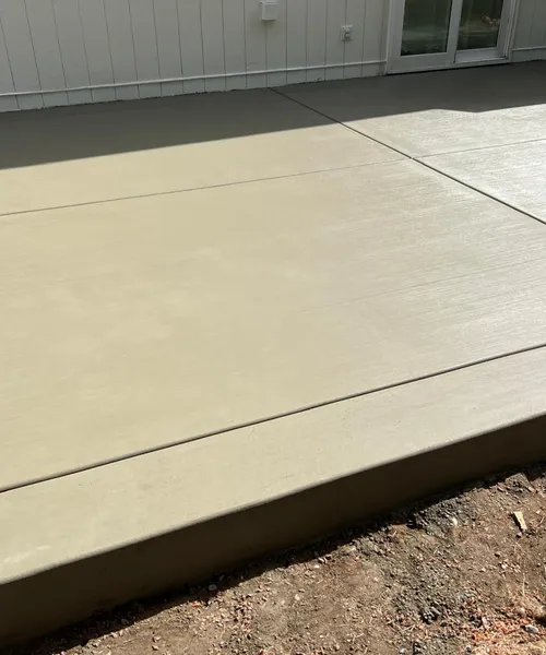 Broom finish patio and decorative borders in Covington 